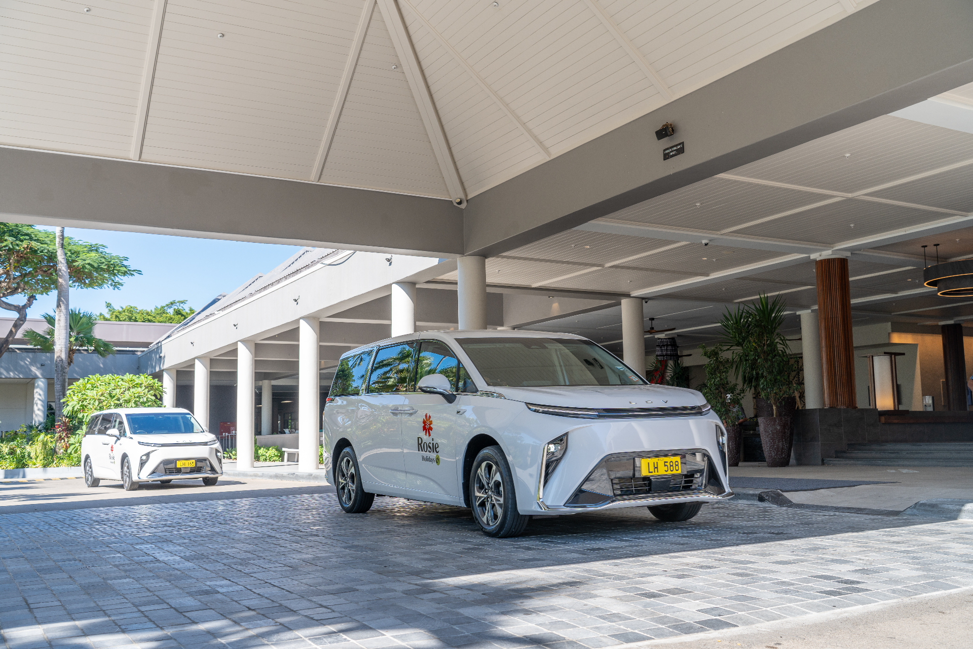 White electric van at Warwick Fiji resort entrance